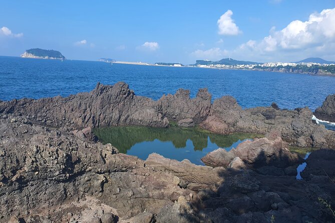 Jeju island Jumbo Taxi Private Tour with Mr.Hong South of Jeju - Oedolgae: a lone stone pillar beside the Olle Trail