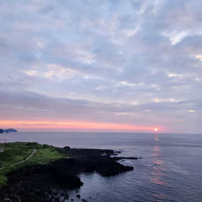Jeju Island: Sunrise Guided Tour with Hotel Pickup - Arriving at Seopjikoji before sunrise