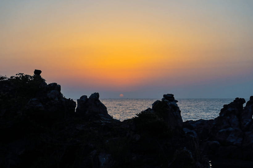 Jeju: Sunset Tour Olle Trail Walking Tour with Hotel Pickup - Leaving Jeju City in a Comfortable Van