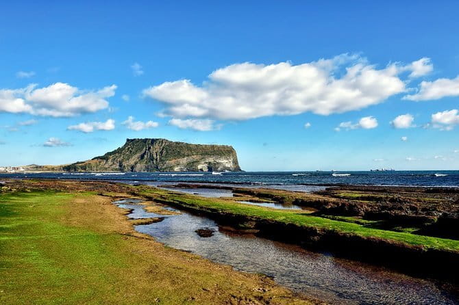 Jeju Unesco Eest course Package Private Van Guided Tour - Seongsan Ilchulbong: The Day’s Main Geological Event