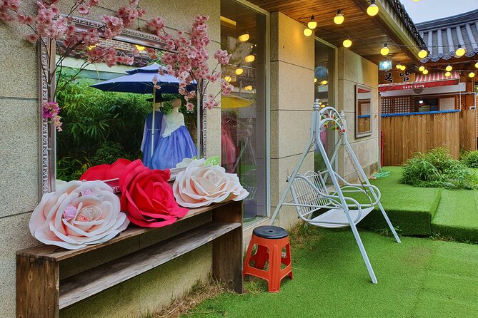 Jeonju Hanok Village Hanbok Rental Experience Hanboknam - Walking through Jeonju Hanok Village in traditional dress