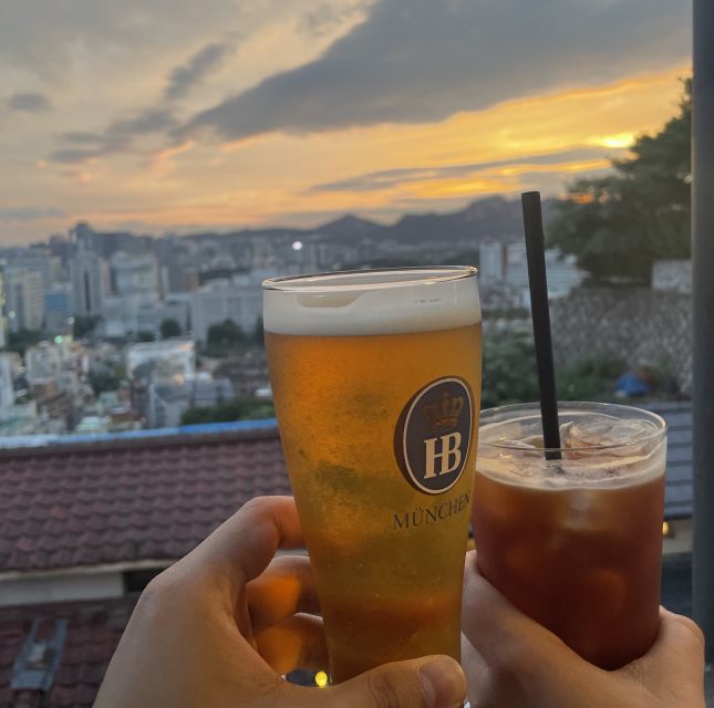 Seoul: Guided City Wall Sunset Hike with Korean Dinner - Heading downhill for a Korean dinner