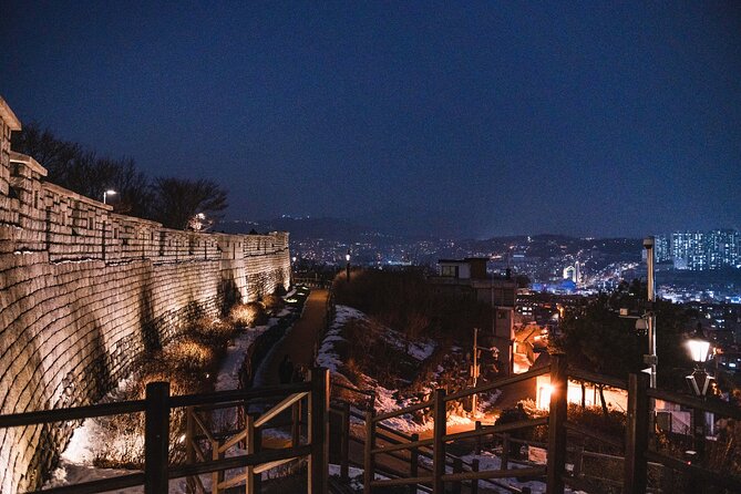 Seoul moonlight walking tour with local historian - Naksan Park turns the climb into a history lesson