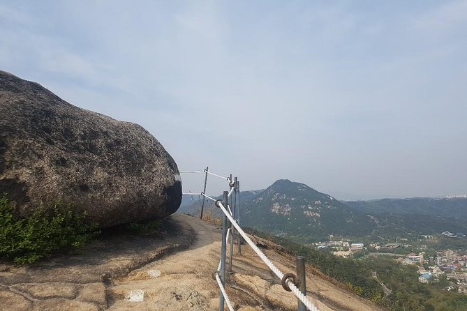 Sunset view & hiking through Seoul Fortress with seafood Market - The spy commando story on the trail