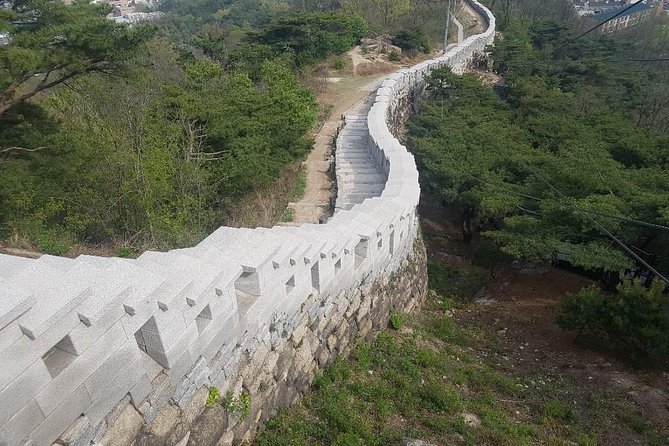 Sunset view & hiking through Seoul Fortress with seafood Market - Inwangsan Mountain and the Seoul Fortress wall